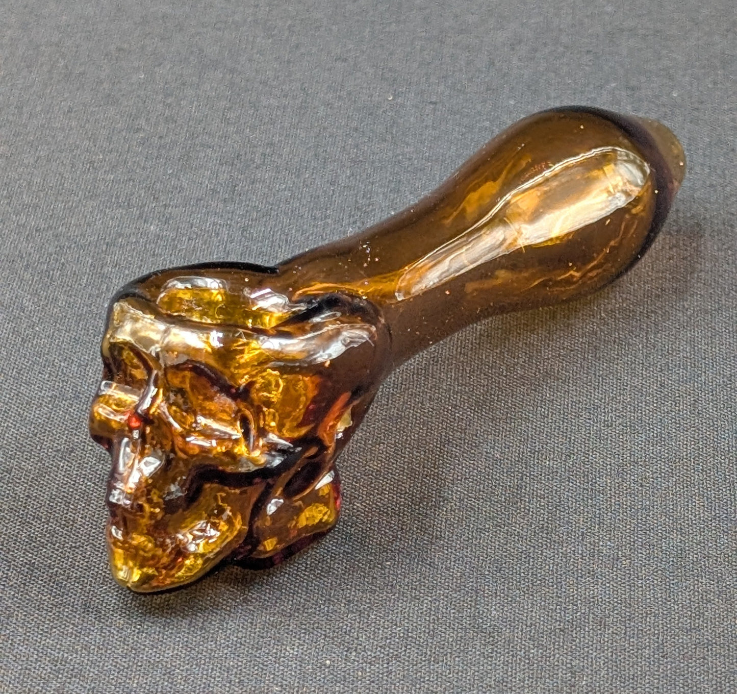 4" Glass Spoon Skull Amber